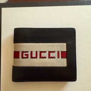 Gucci bifold wallet with gucci stripe